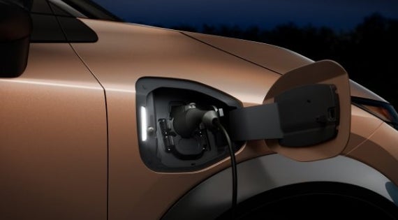 Close-up image of charging cable plugged in | Nissan of San Jose in San Jose CA
